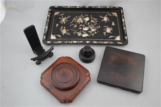 Four Chinese rosewood stands and a Chinese wood and mother of pearl inlaid tray, 19th / early 20th century, 33cm.